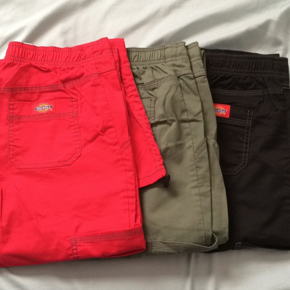 Lot of extra small scrubs, 3 pairs of pants 7 tops